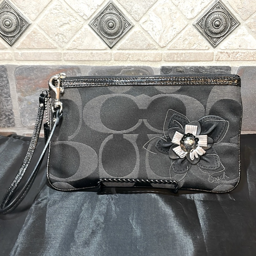 Vintage Coach Wristlet With Metallic Leather Flower Embellishment very unique